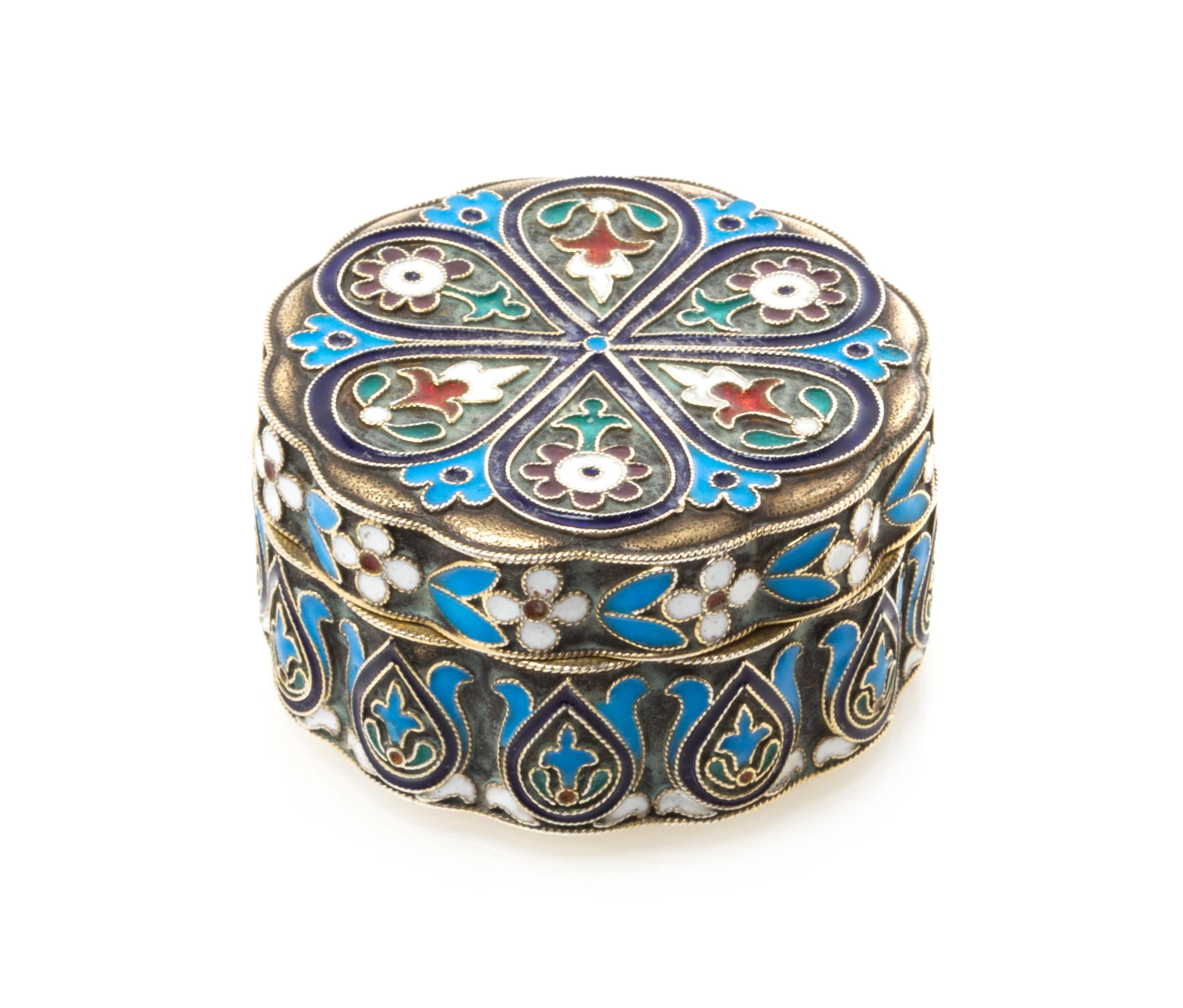 A Russian Silver and Enamel Pill Box, Maker's mark Cyrillic IS, city mark likely Odessa, of lobed, circular form and decorated with pol