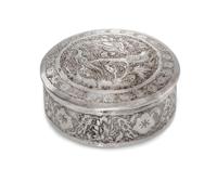 A Chinese Silver Box, , of circular form, the lid decorated with exotic bords and a repeating floral border.