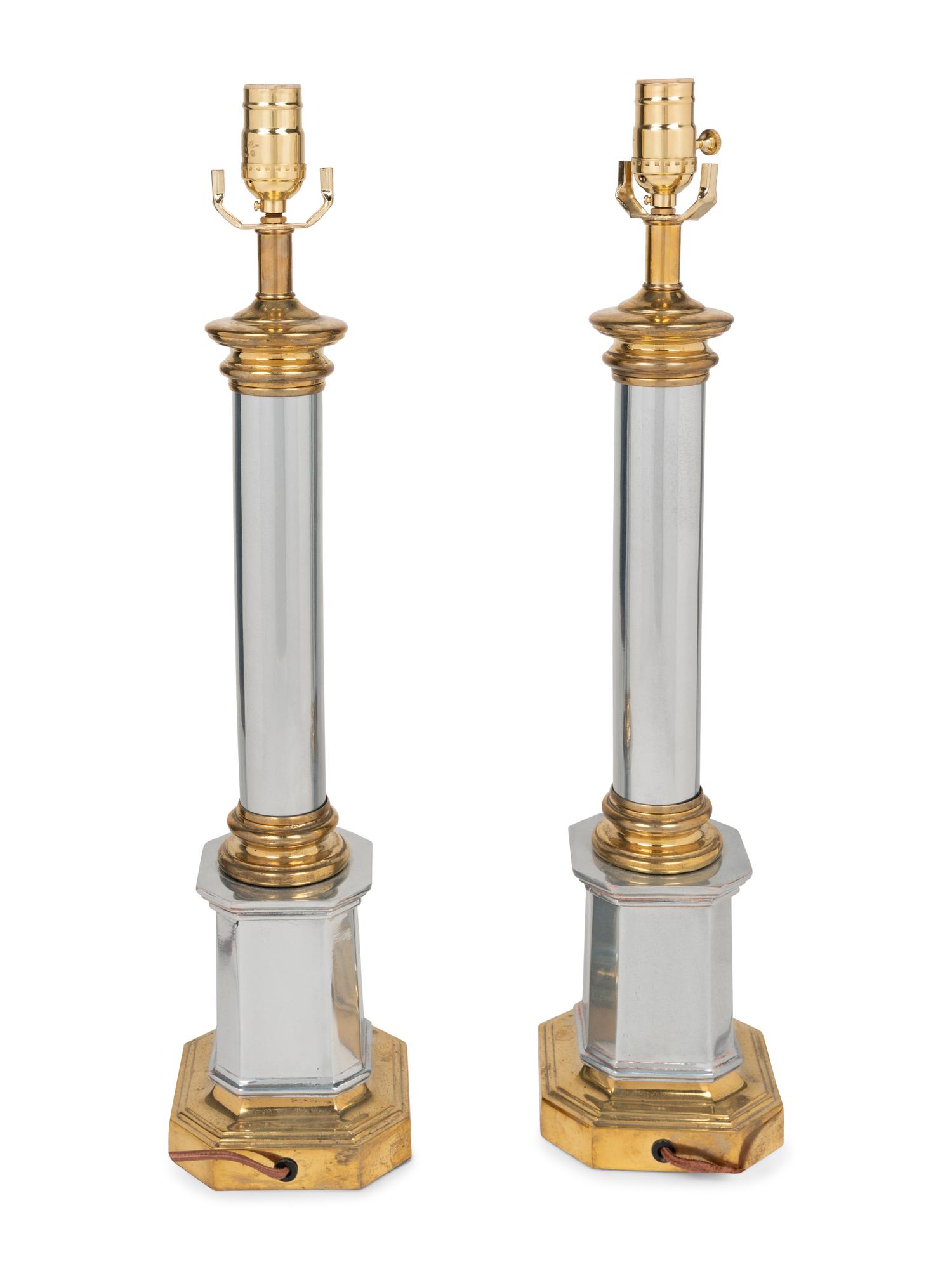 A Pair of Brass and Steel Columnar Lamps
