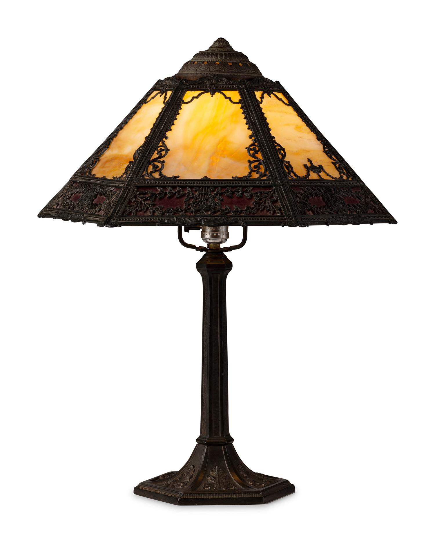 A Cast Iron and Slag Glass Table Lamp