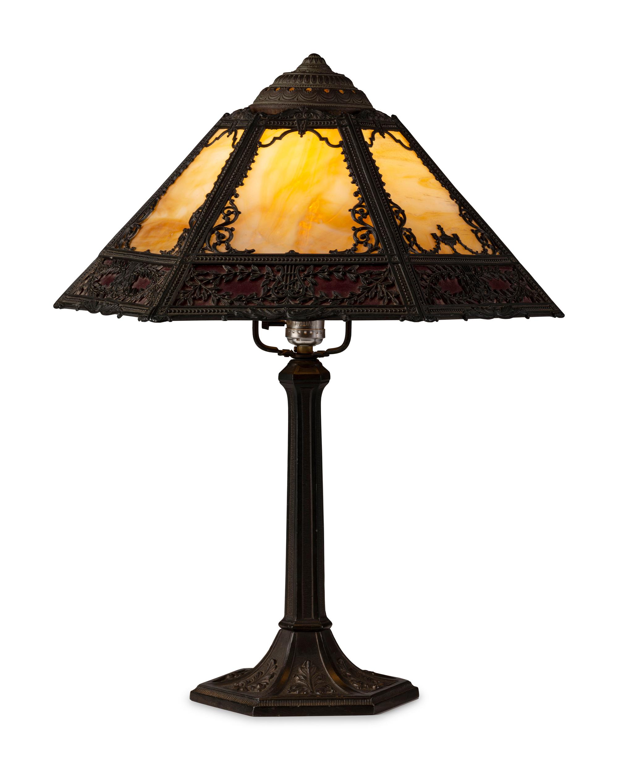 A Cast Iron and Slag Glass Table Lamp