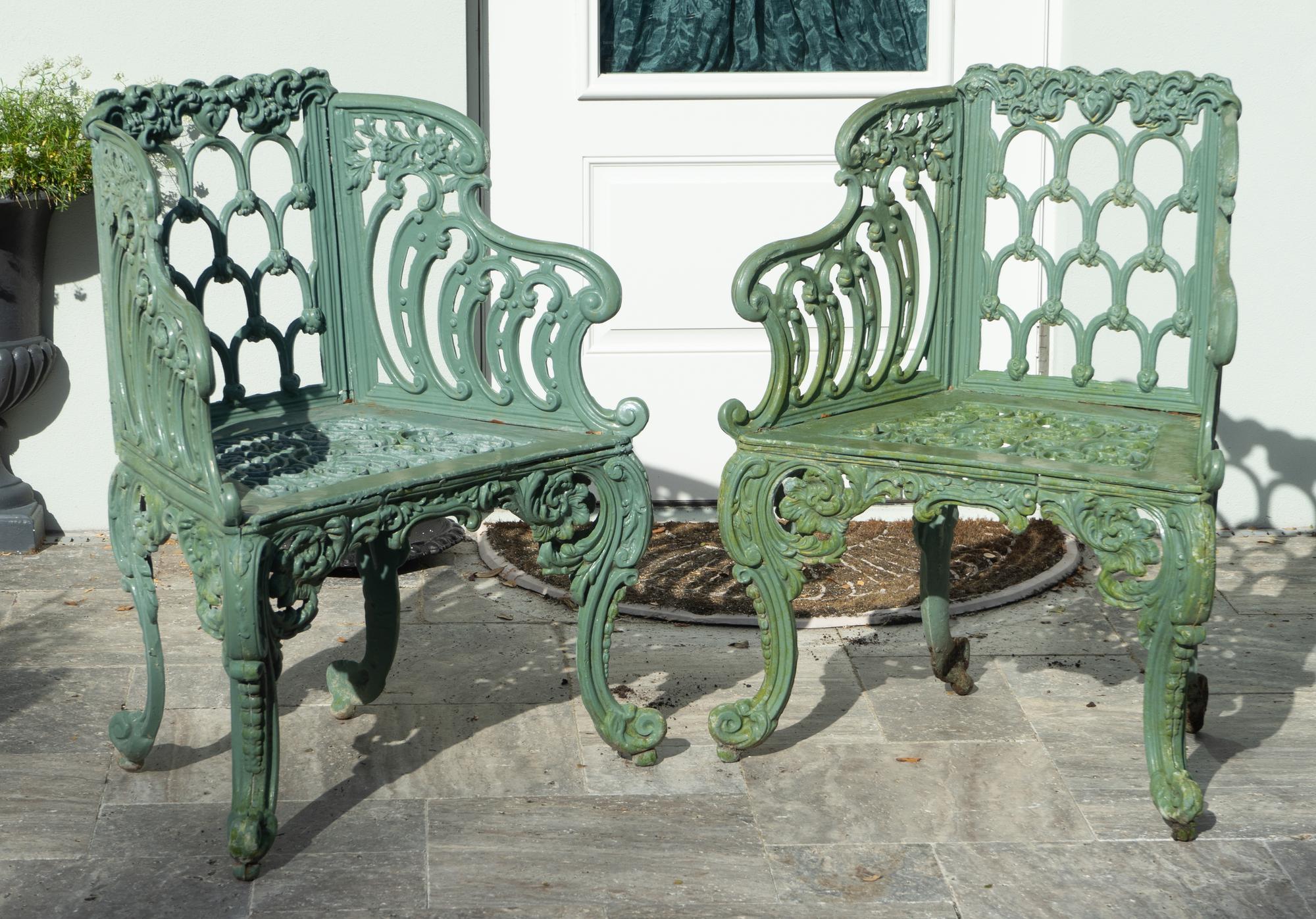 A Green-Painted Metal Garden Bench and Pair of Armchairs
