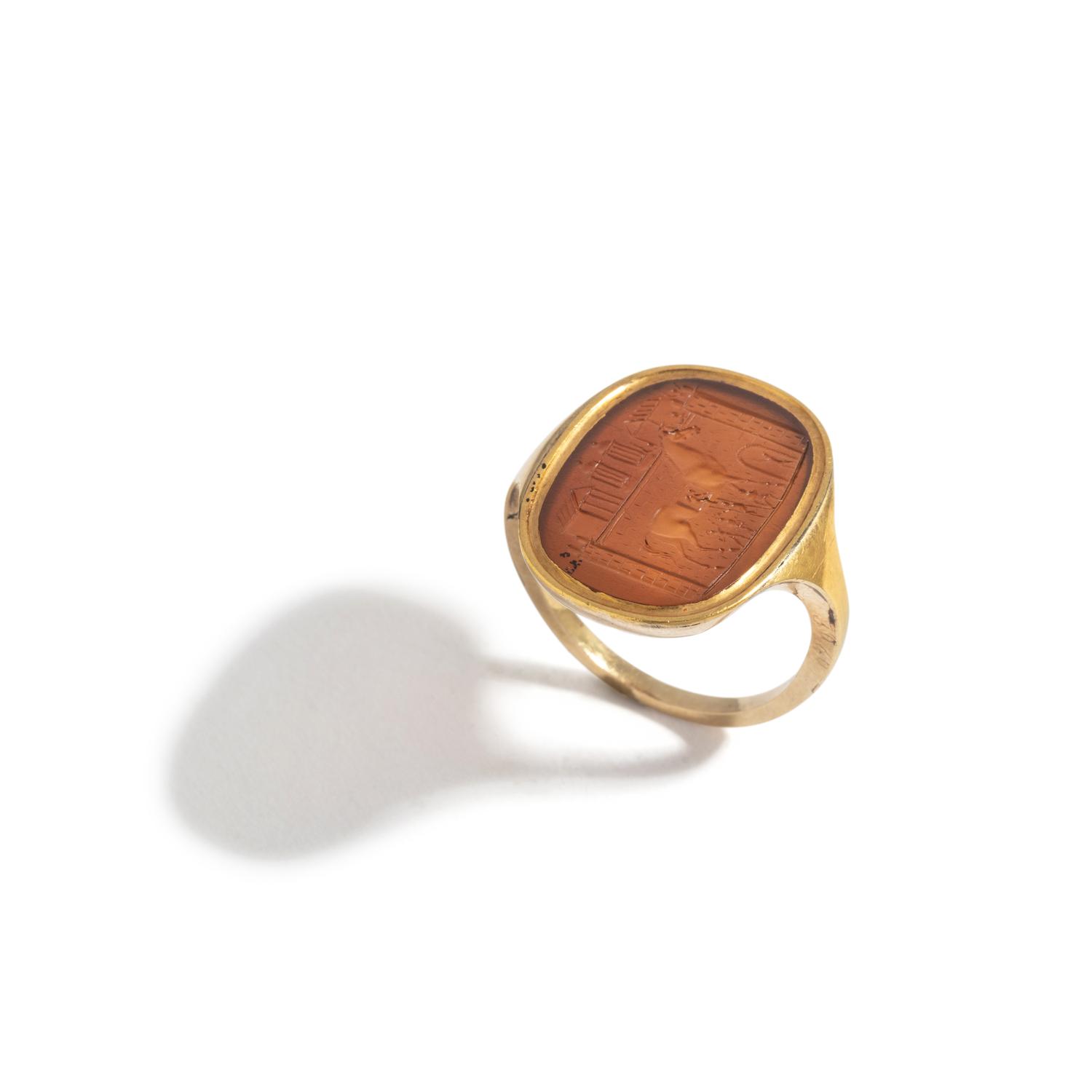 A Neoclassical Gold and Glass Finger Ring with a Homeric Scene of the Trojan Horse