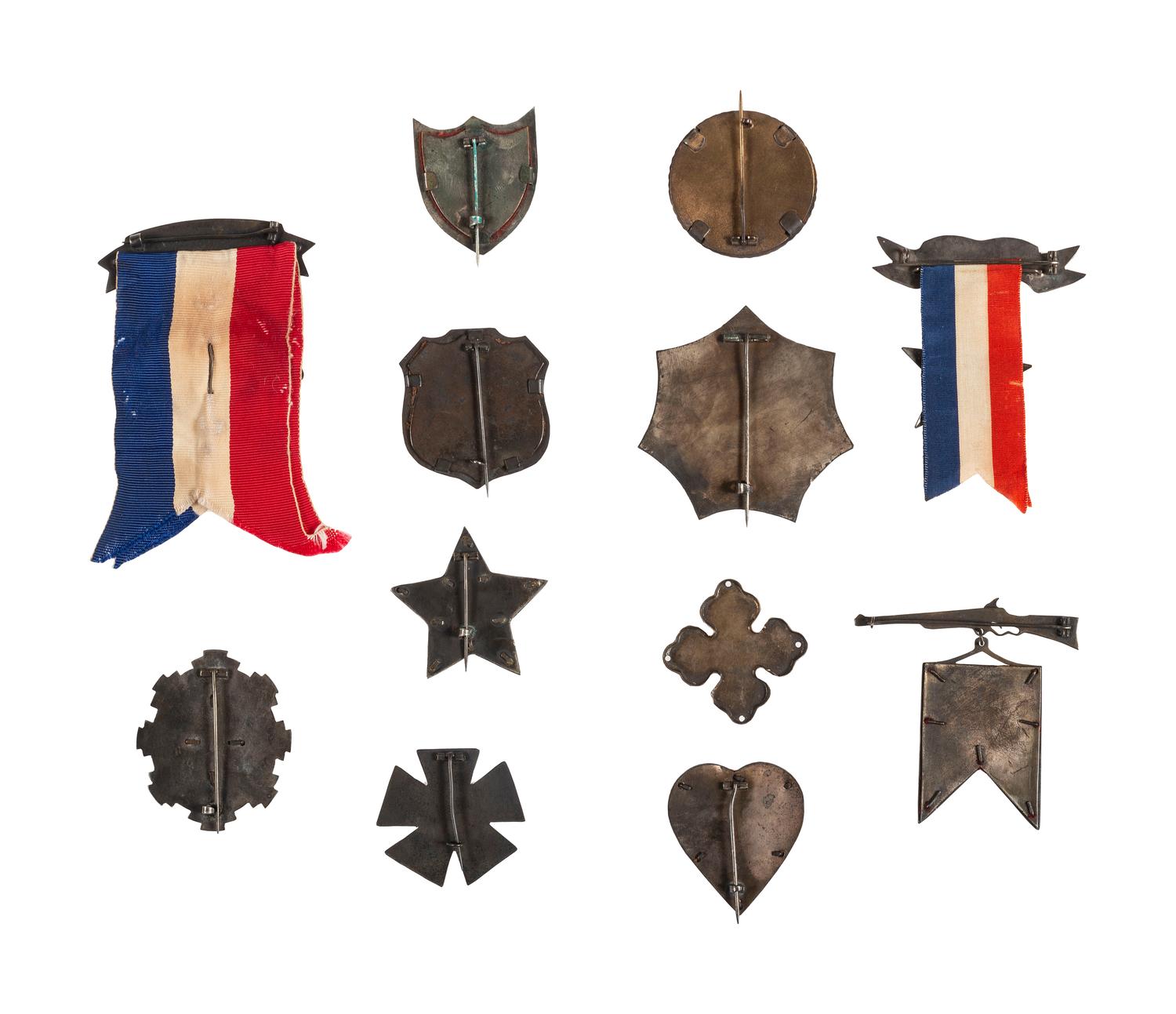 A group of 12 reproduction/fantasy corps badges collected for educational purposes, including: