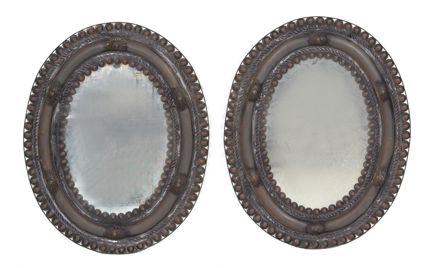 A Pair of Stamped Metal Oval Mirrors 30 1/2 x 24 inches. — EARLY 20TH CENTURY