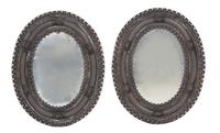 A Pair of Stamped Metal Oval Mirrors 30 1/2 x 24 inches. — EARLY 20TH CENTURY