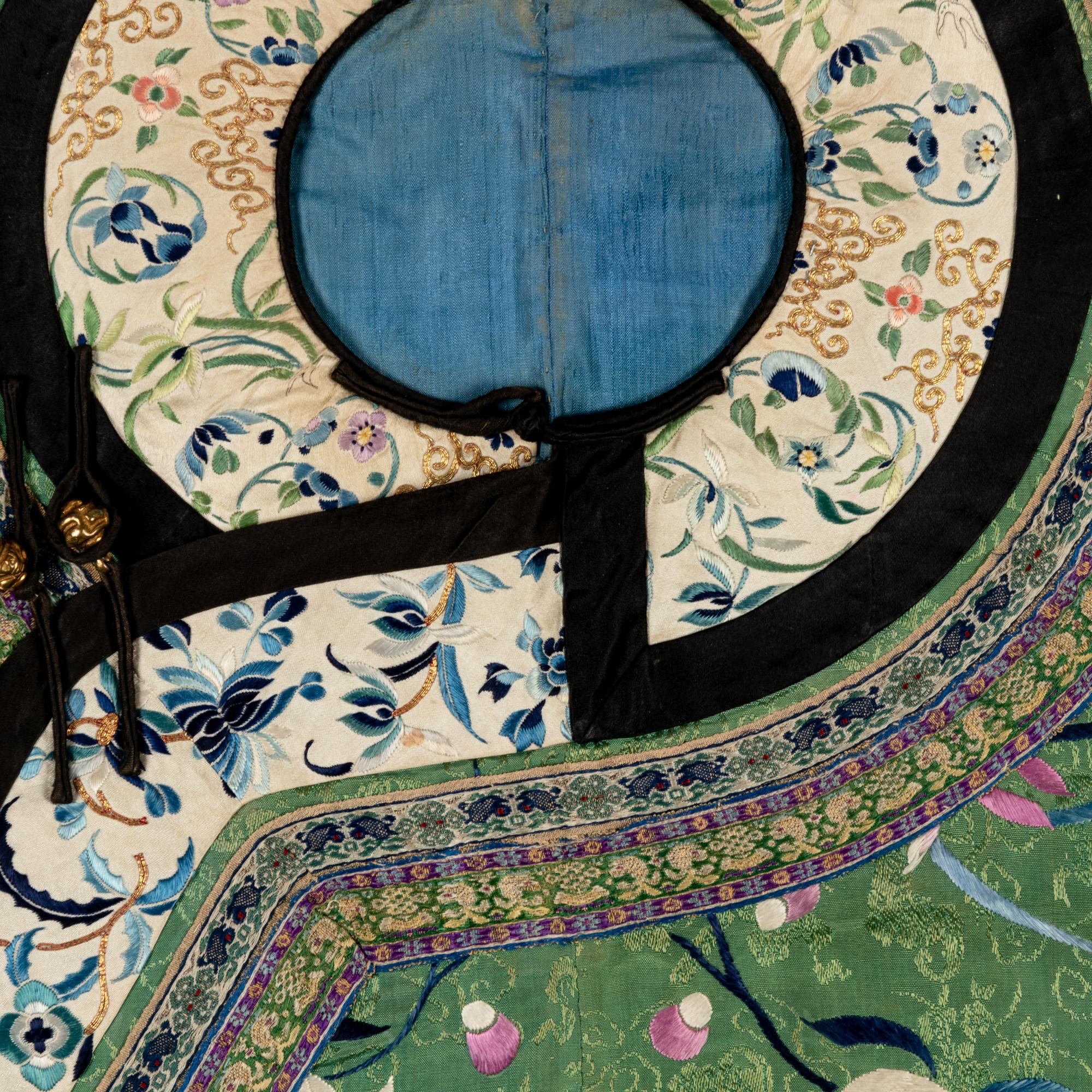 A Chinese Apple Green Ground Embroidered 'Peonies and Insects' Silk Lady's Robe, Changyi, 19th Century 清晚期 蘋果綠地綉牡丹草蟲氅衣