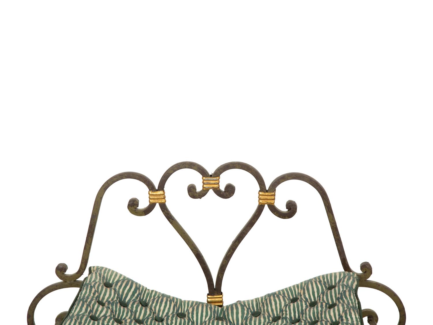 A Pair of Painted and Parcel Gilt Iron Curule Stools with Tufted Cushions