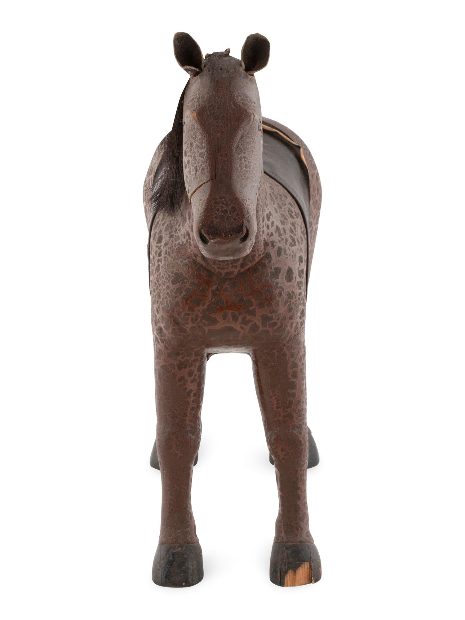 A Folk Art Carved and Painted Wooden Horse