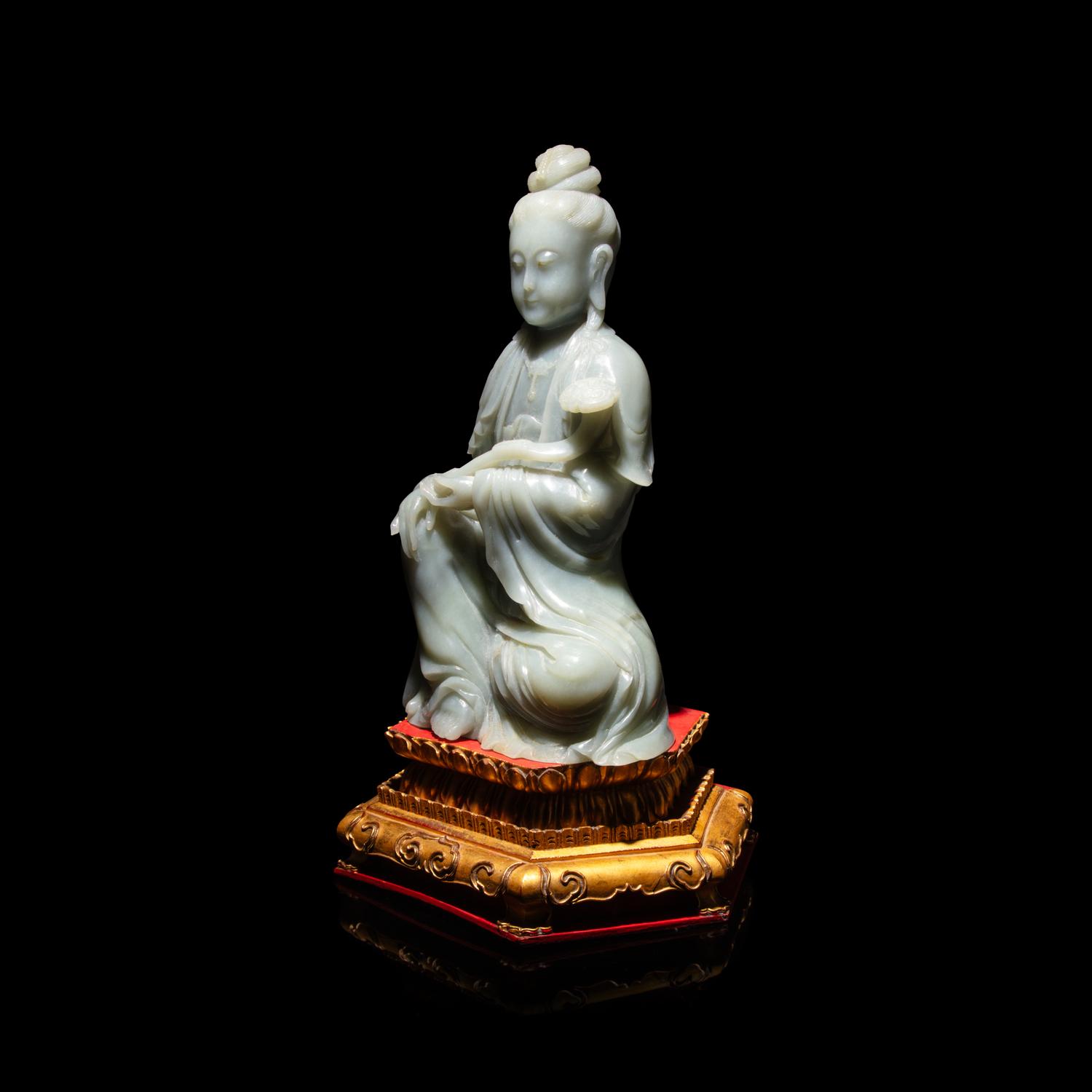A Chinese Celadon Jade Seated Guanyin, 20th Century — 近代 青玉觀音坐像