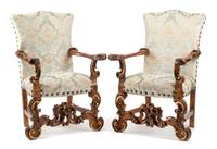 A Pair of Spanish Renaissance Style Painted and Parcel Gilt Armchairs Height 44 inches.