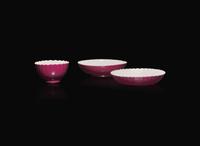 A Chinese ruby-back porcelain "Wan Shou Wu Jiang" "Peach" tea bowl and two saucers, Possibly 18th century 萬壽無疆茶杯及兩小碟 或十八世紀