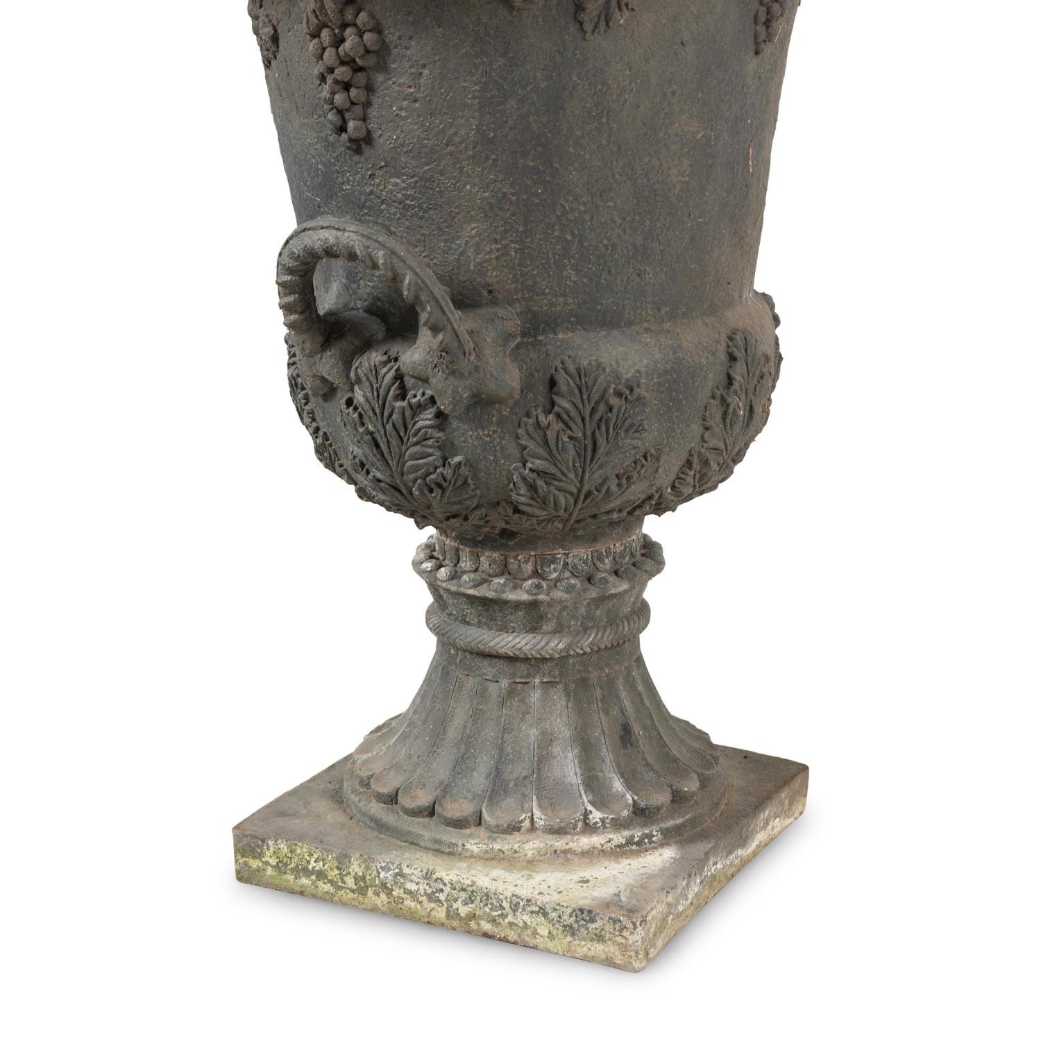 A Pair of Composition Garden Urns
