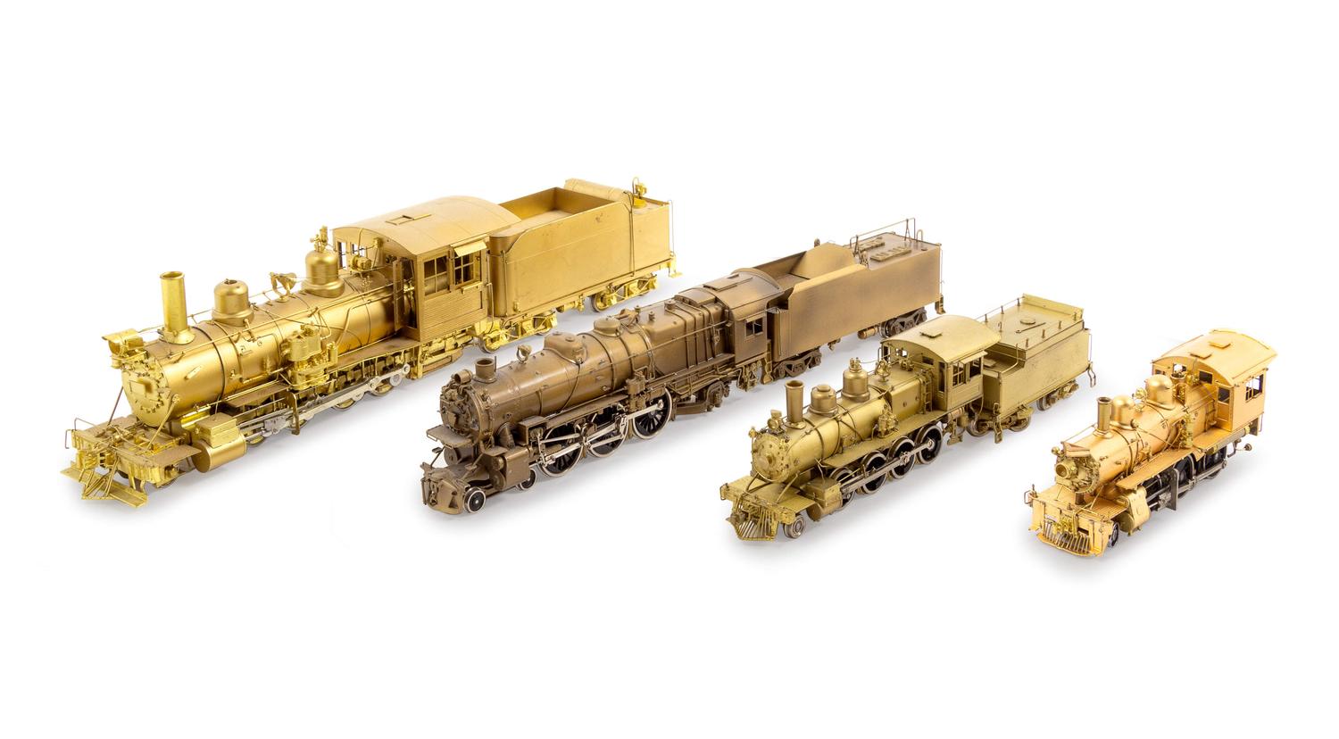 A Group of Four Brass Locomotives and Three Tenders