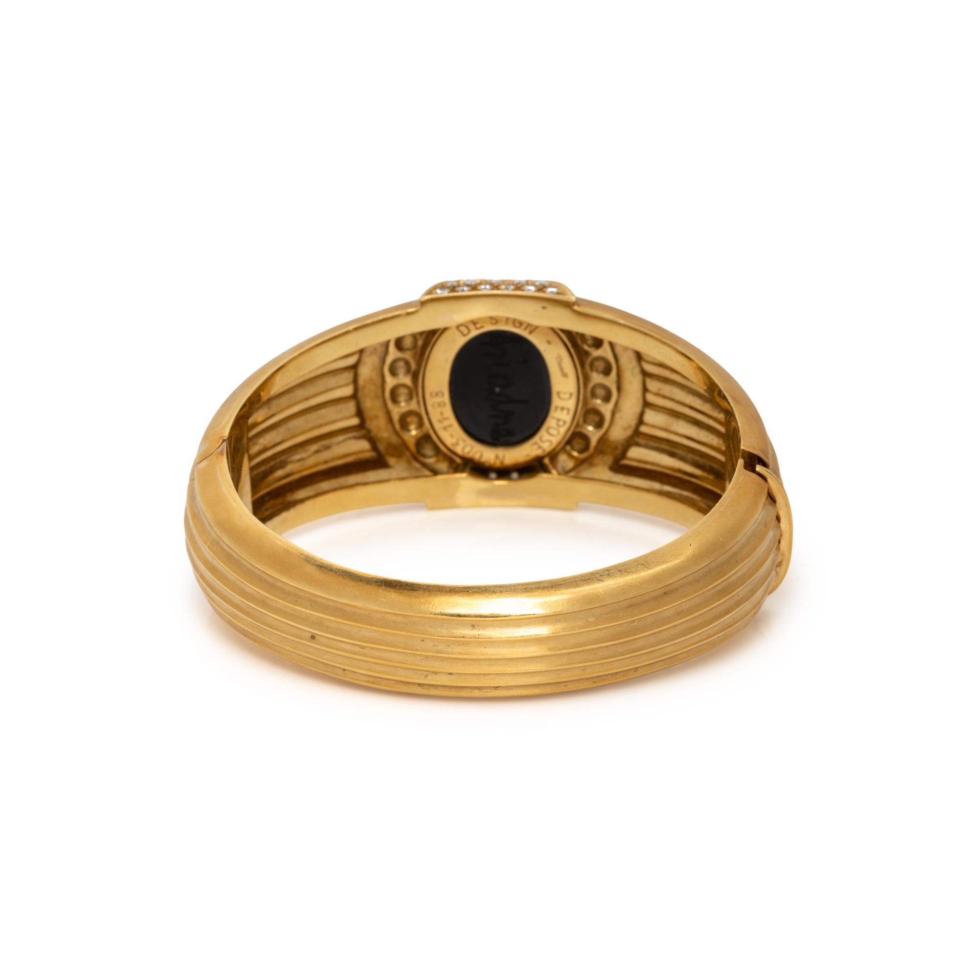TINELLI, YELLOW GOLD, ONYX, AND DIAMOND 'ARIADNE' BANGLE BRACELET