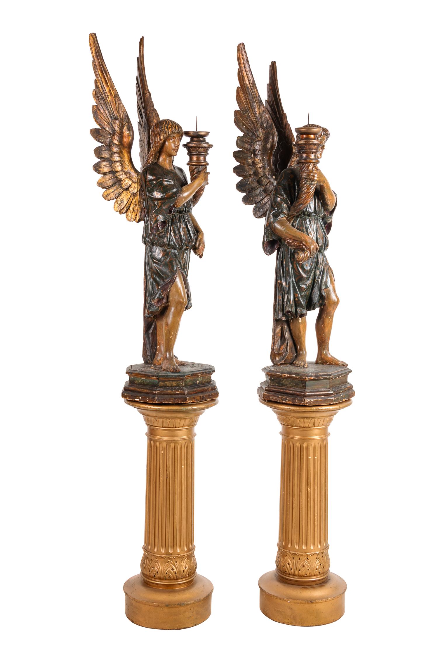 A Pair of Continental Carved and Painted Figural Prickets with Associated Pedestals
