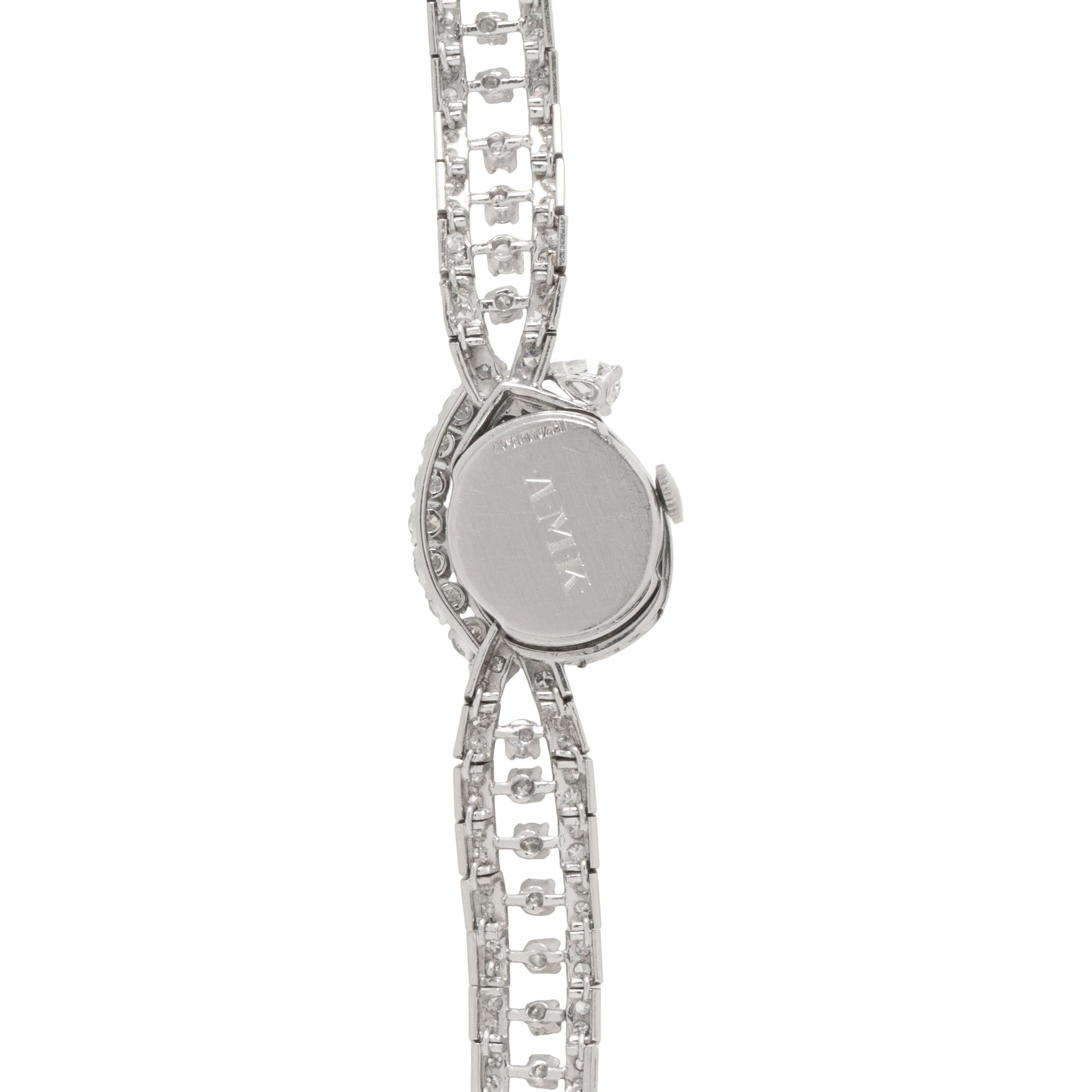 HAMILTON, PLATINUM AND DIAMOND SURPRISE WATCH
