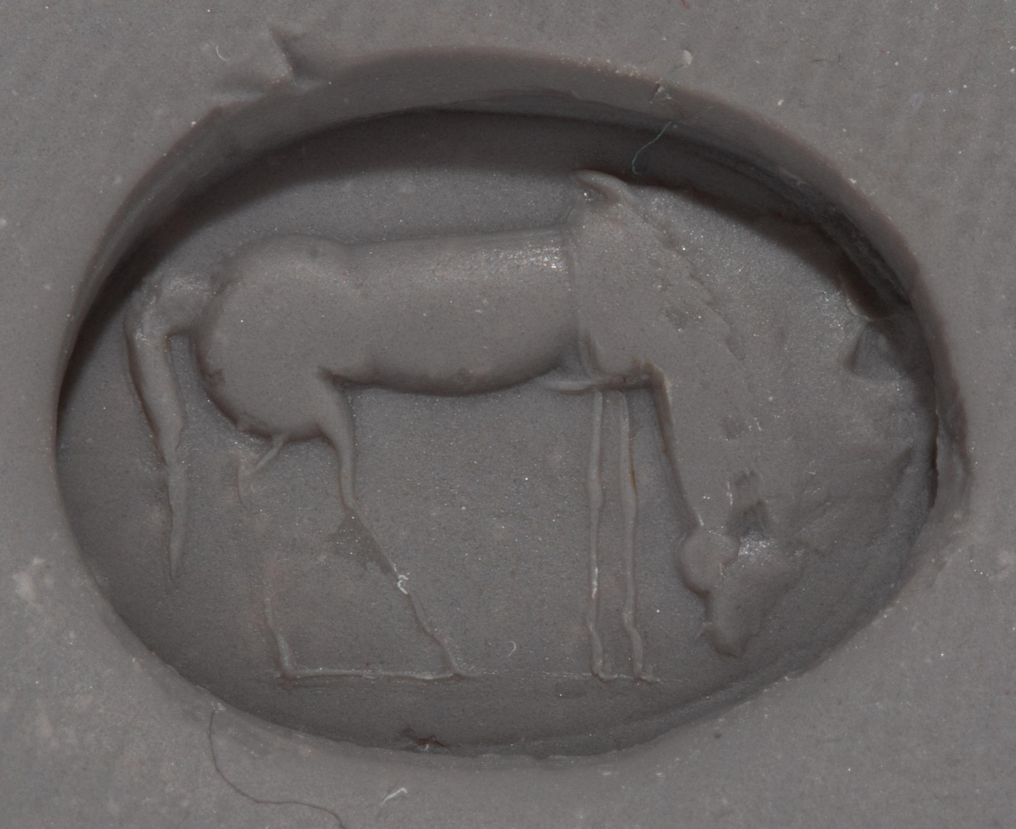 A Roman Red Jasper Ring Stone with a Grazing Horse