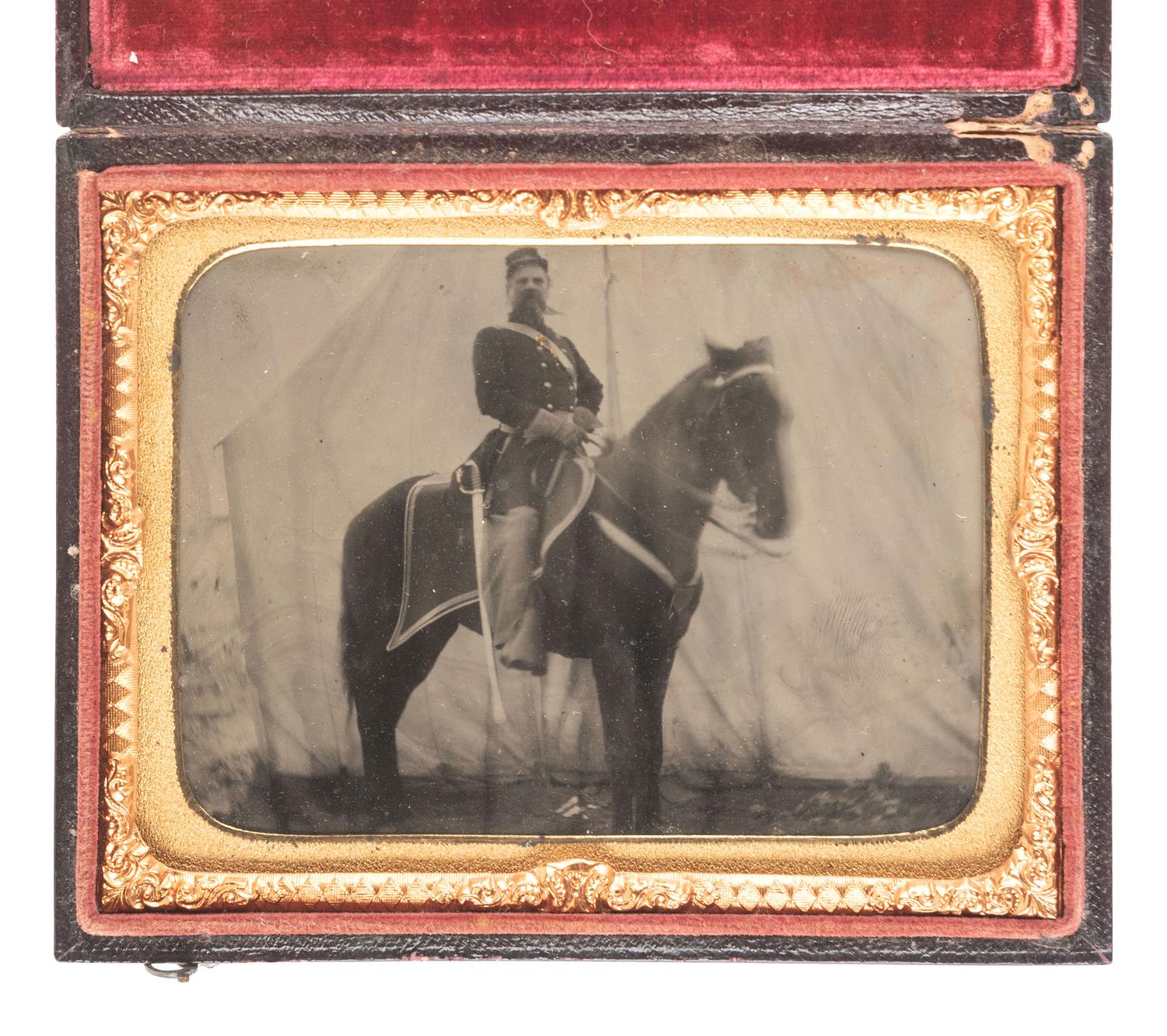 [CIVIL WAR]. Quarter plate tintype featuring a cavalryman on horseback in front of a large tent.