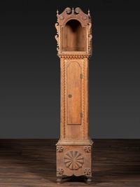 A Folk Art Carved Maple Clock Case