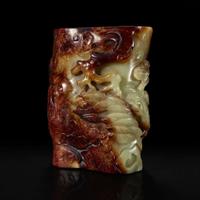 A Chinese carved russet and celadon jade brush holder 青玉笔筒