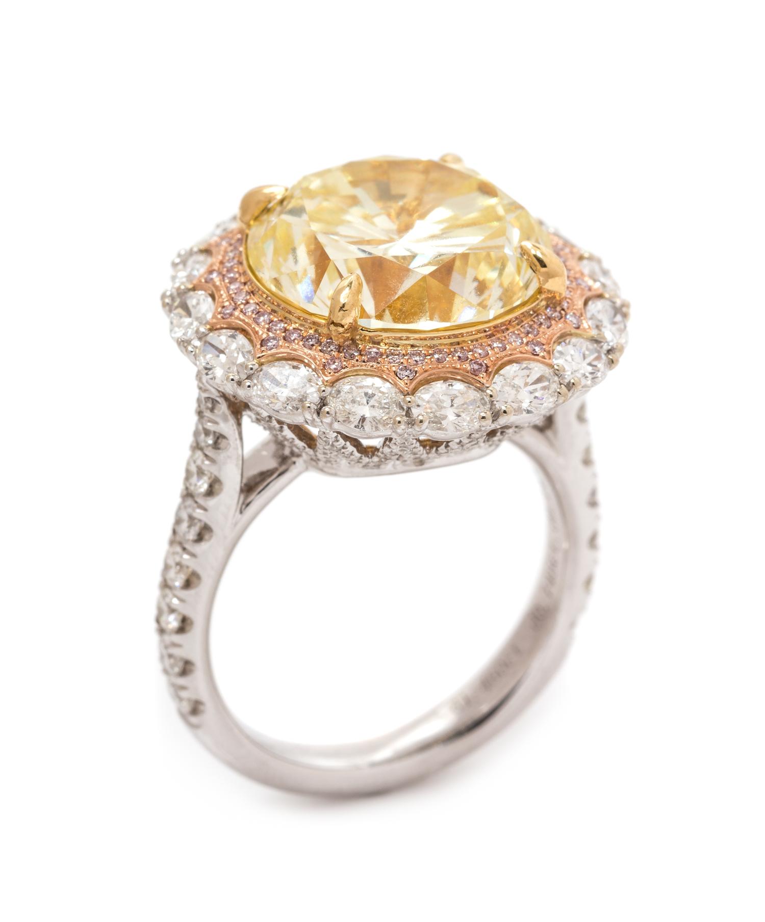 An 18 Karat Tricolor Gold, Fancy Yellow Diamond, Diamond and Colored Diamond Ring, 10.10 dwts.