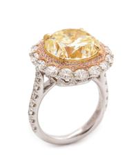 An 18 Karat Tricolor Gold, Fancy Yellow Diamond, Diamond and Colored Diamond Ring, 10.10 dwts.