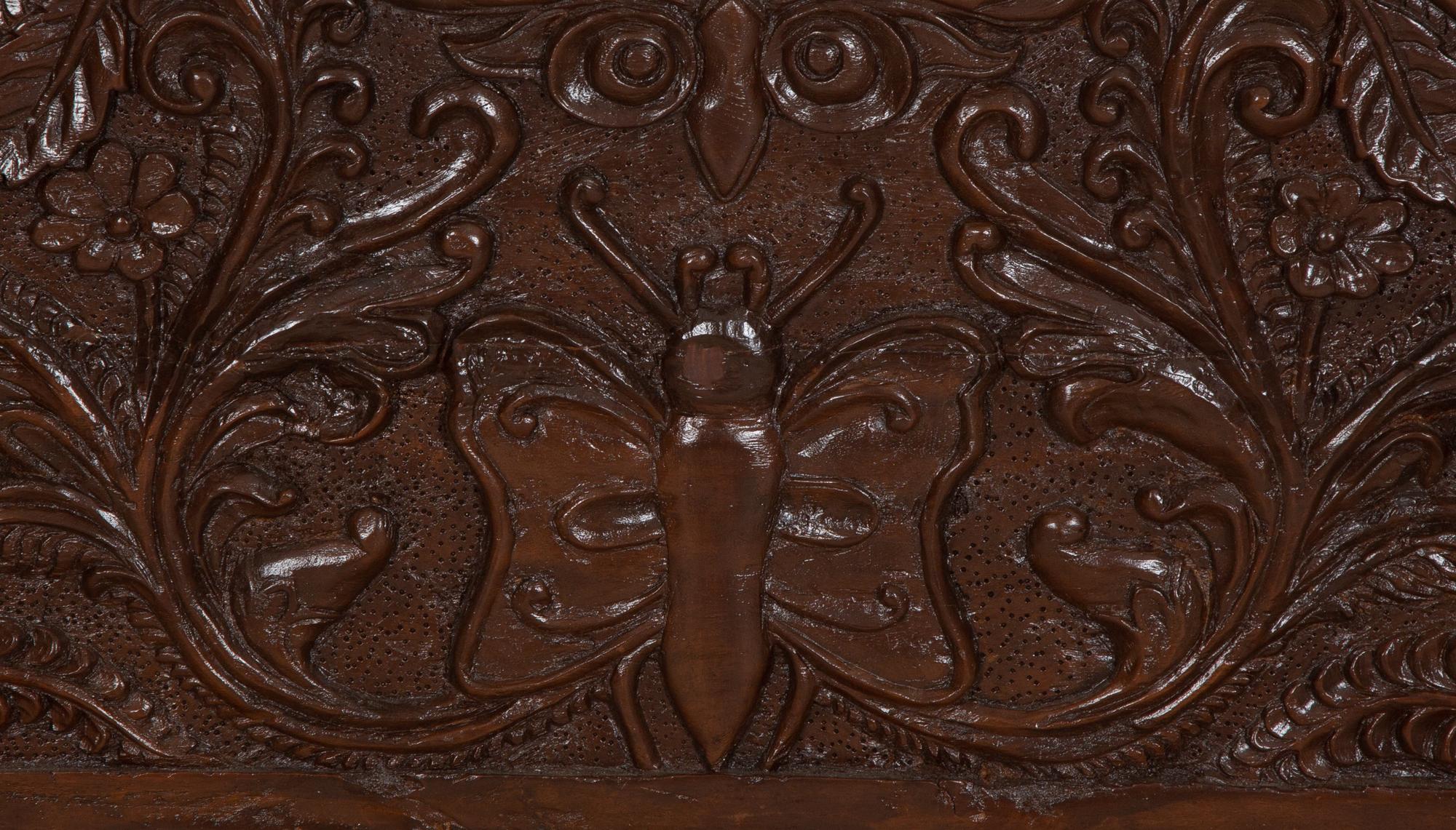 A British Colonial Carved Mahogany and Cane Work Settee