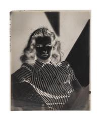 [HOLLYWOOD PHOTOGRAPHY]. A group of 17 photographic portrait negatives and transparencies of Veronica Lake. c. 1940.