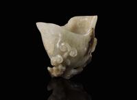 A small Chinese carved greyish-celadon and brown jade coupe, Qing dynasty or earlier 青灰玉小爵杯 清或更早