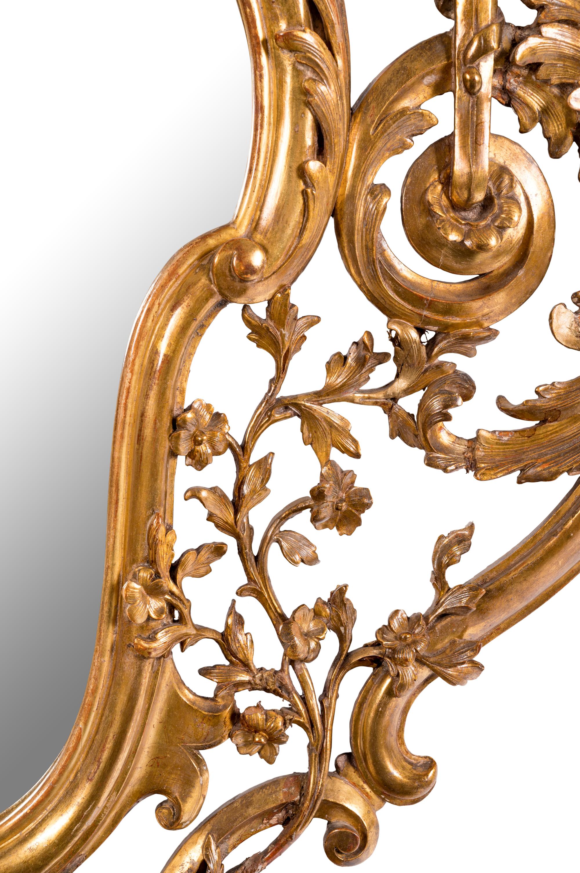 An Italian Baroque Style Giltwood Mirror