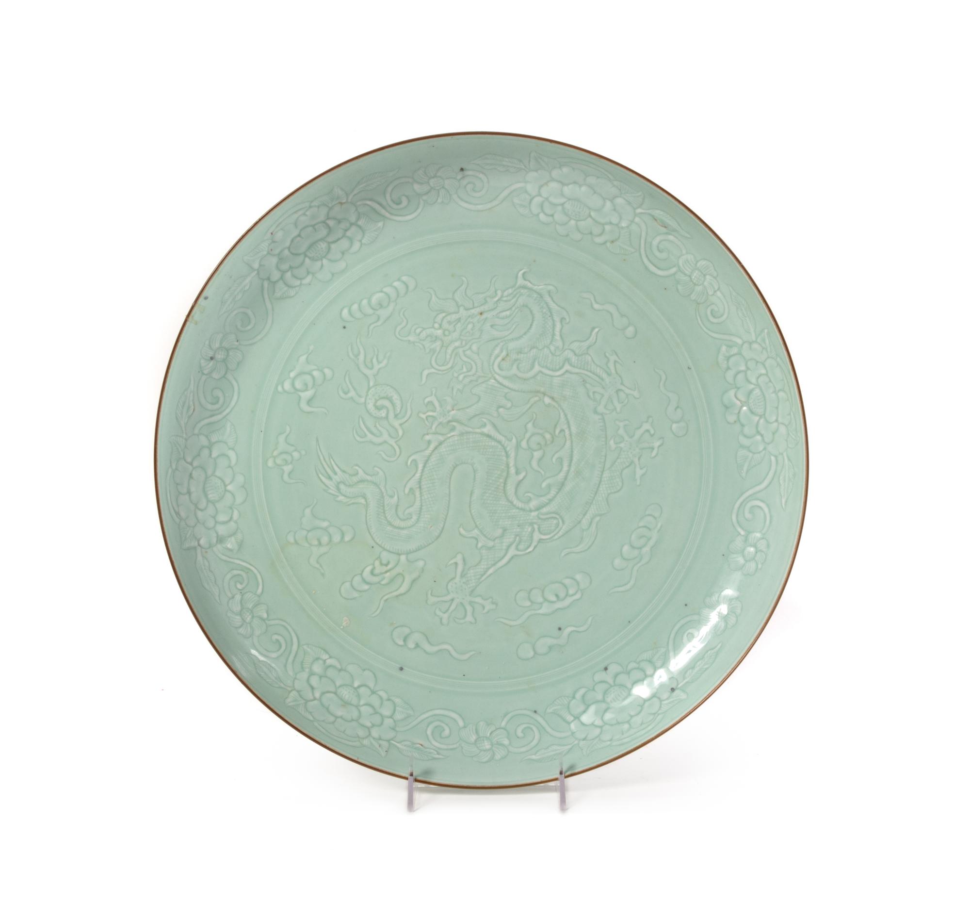A Large Carved Celadon Glazed Porcelain Charger