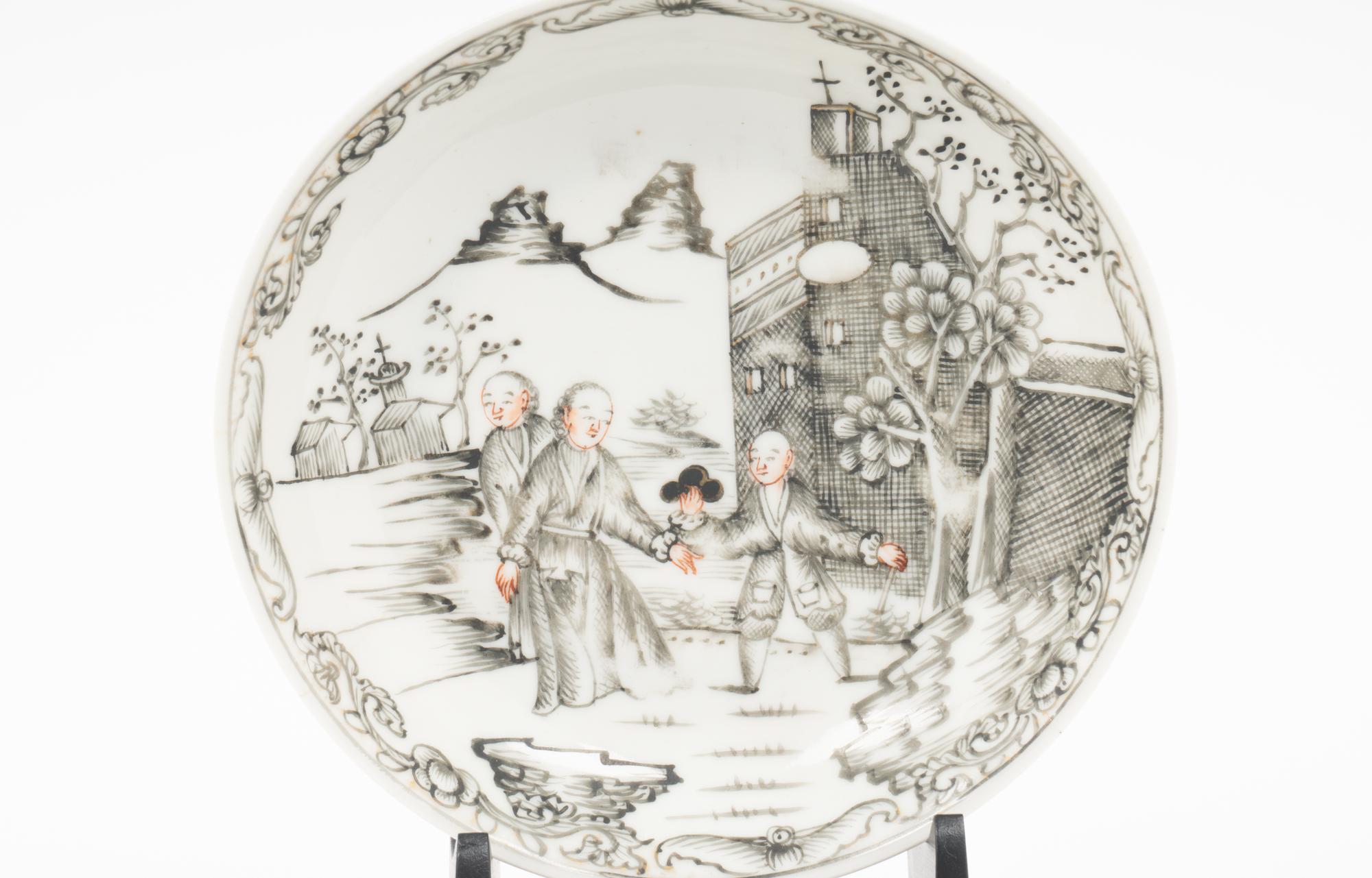 A Chinese Export 'Jesuit' En Grisaille Porcelain Teacup and Saucer