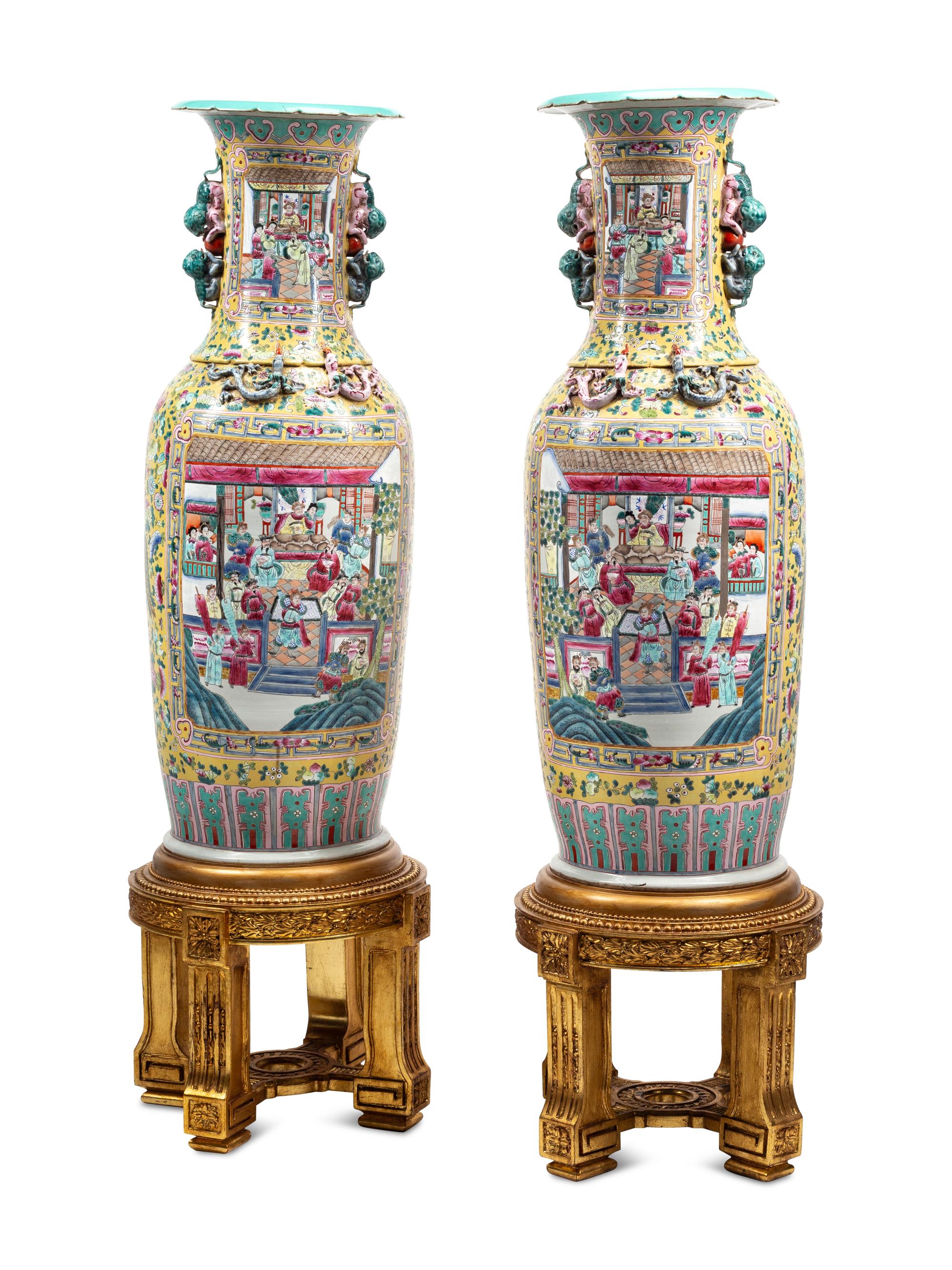 A Pair of Monumental Famille Jaune Porcelain Vases on Giltwood Stands