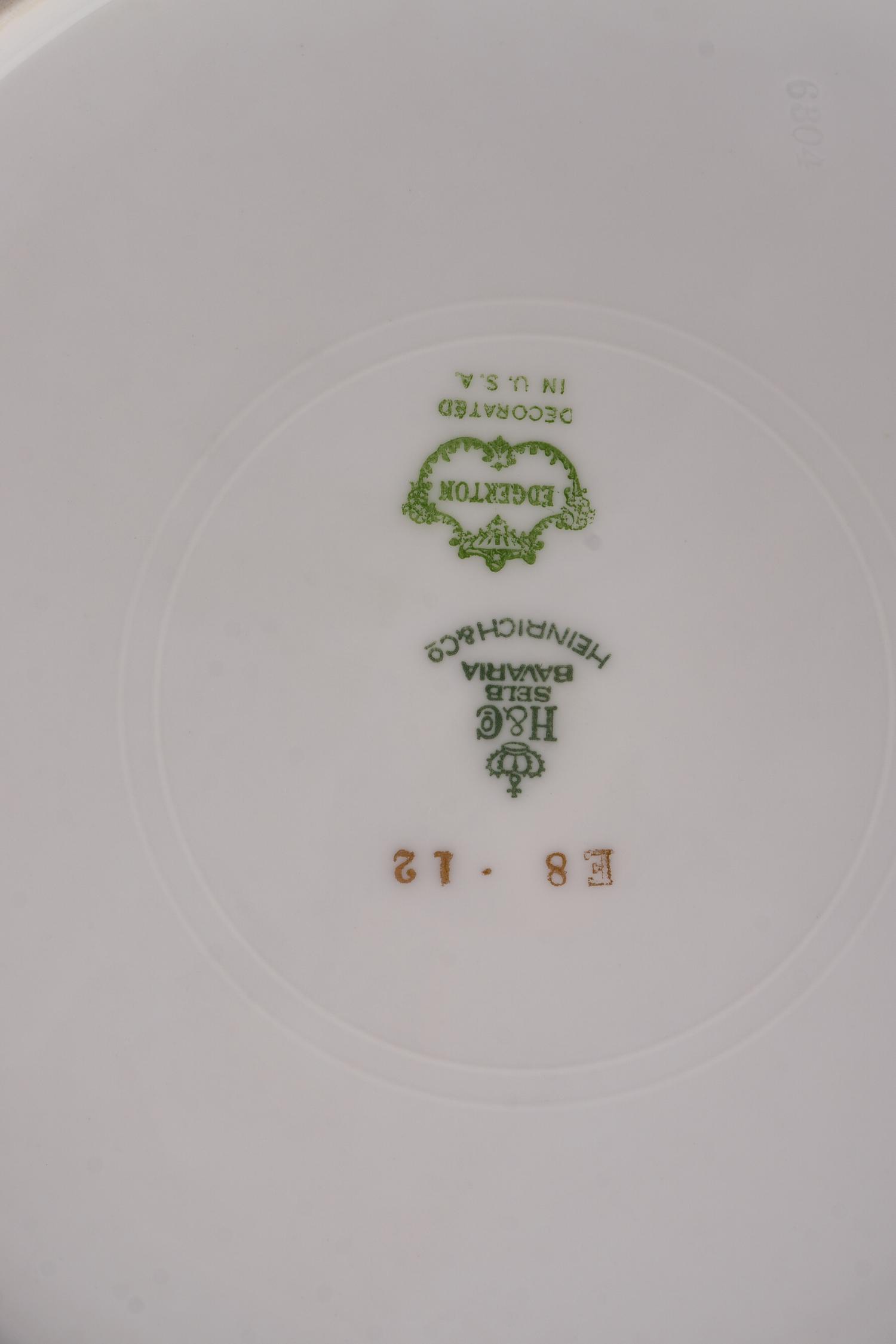 A Set of Twelve Bavarian Gilt Decorated Porcelain Plates