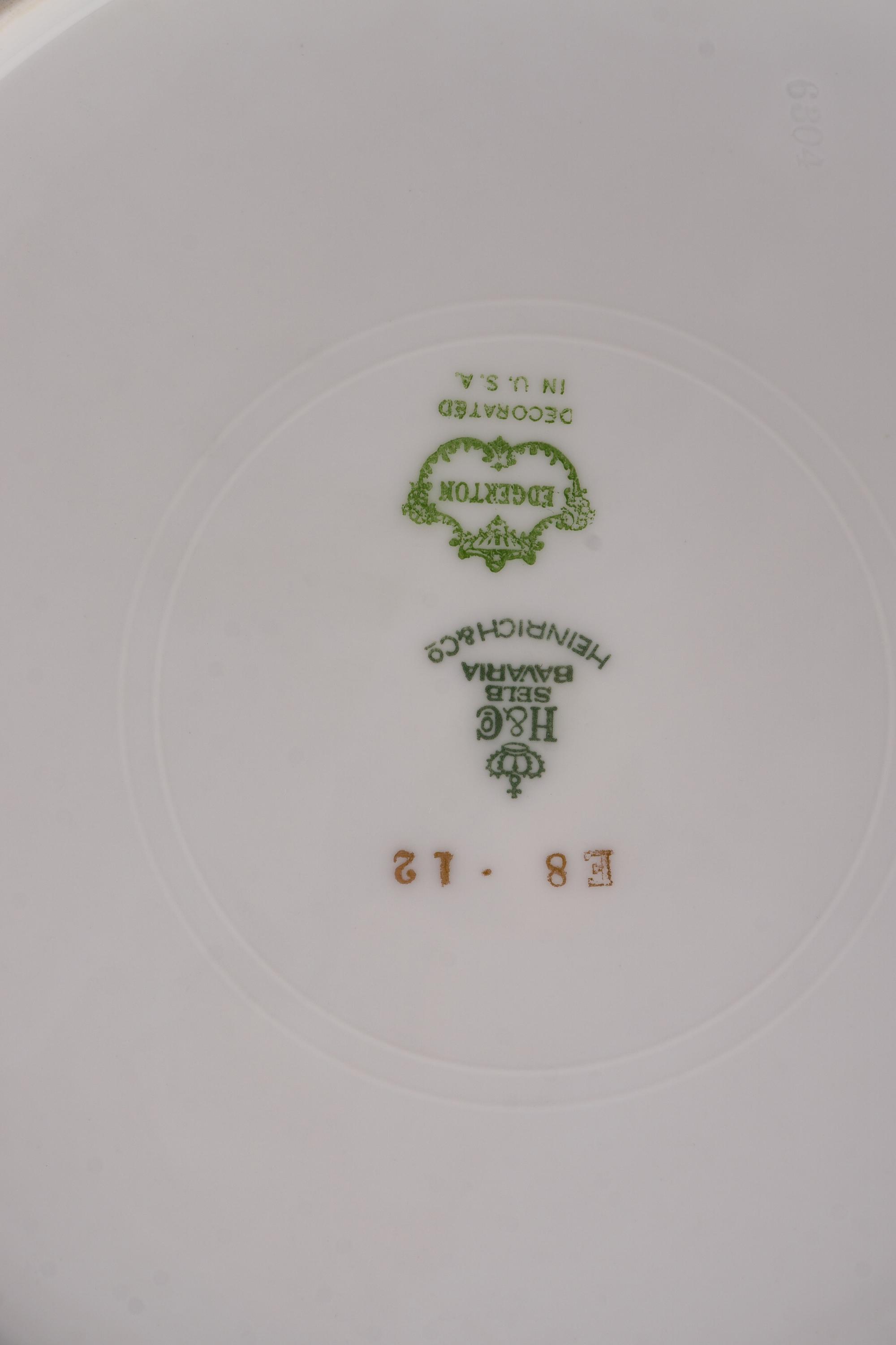 A Set of Twelve Bavarian Gilt Decorated Porcelain Plates