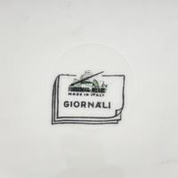A Set of Eleven Piero Fornasetti Giornali Porcelain Dinner Plates