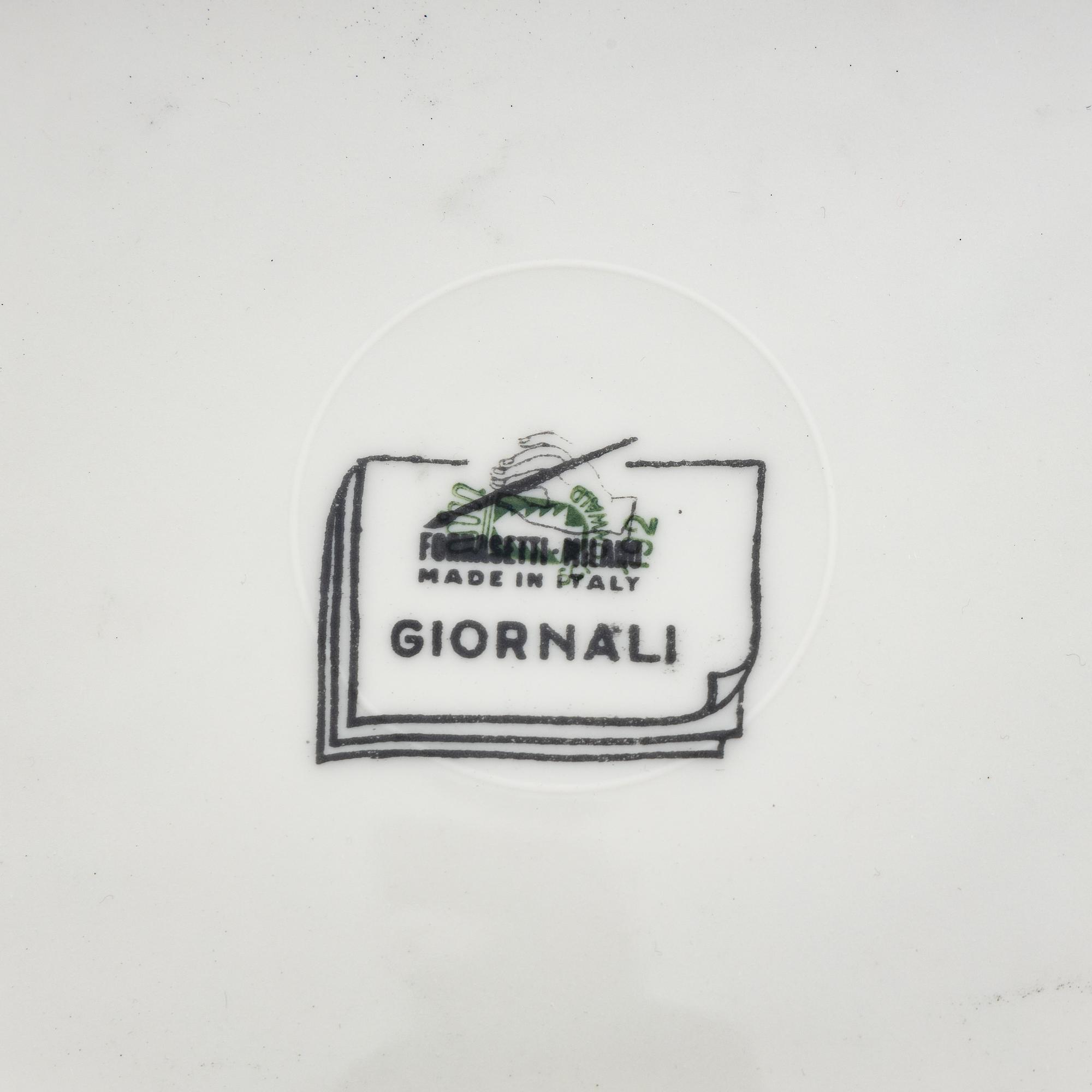 A Set of Eleven Piero Fornasetti Giornali Porcelain Dinner Plates