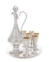A Russian Silver Liquor Service, Mark of Ivan Khlebnikov, Moscow, Early 20th Century, comprising a ewer, underplate and six cordials, e