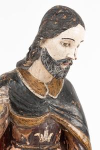 A Continental Painted Figure of a Saint with a Dog