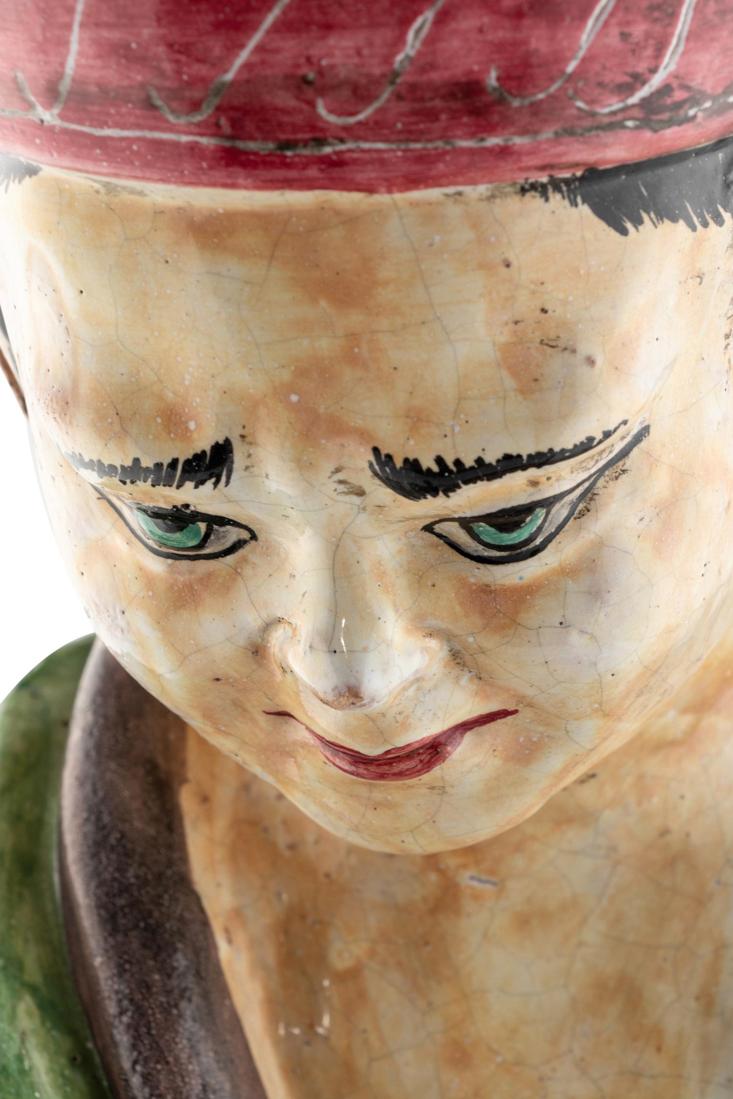 An Italian Polychrome-Glazed Terra Cotta Chinoiserie Figure