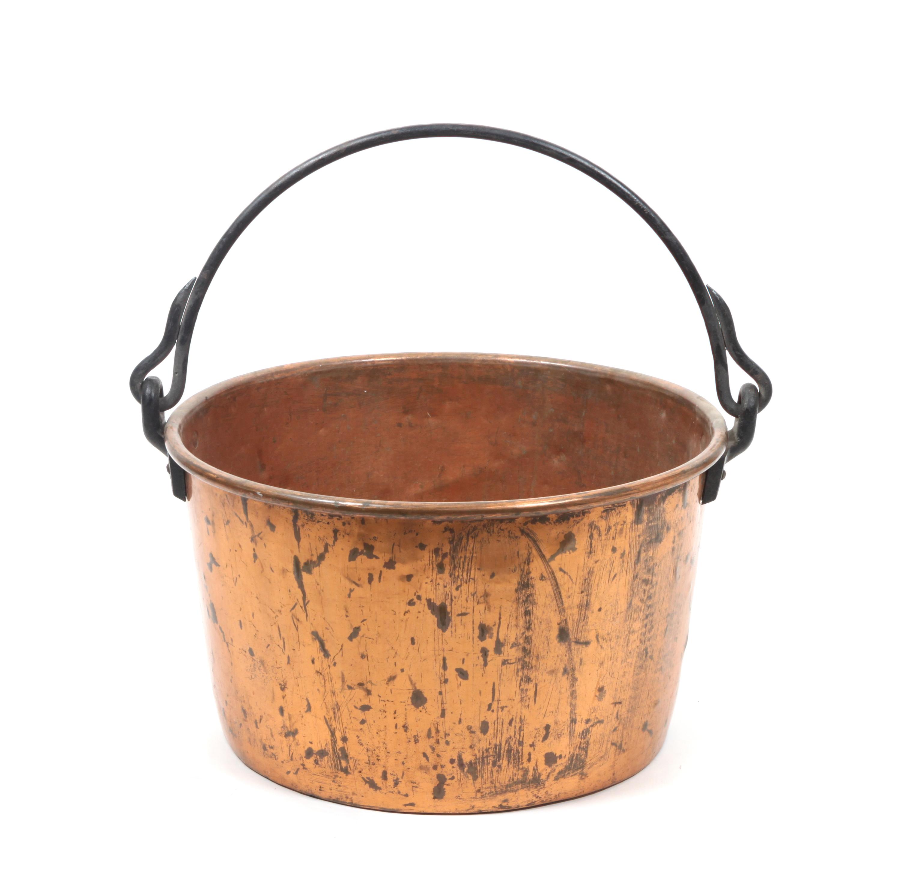 A Large Copper Cauldron Height 14 1/2 x diameter 26 1/2 inches.