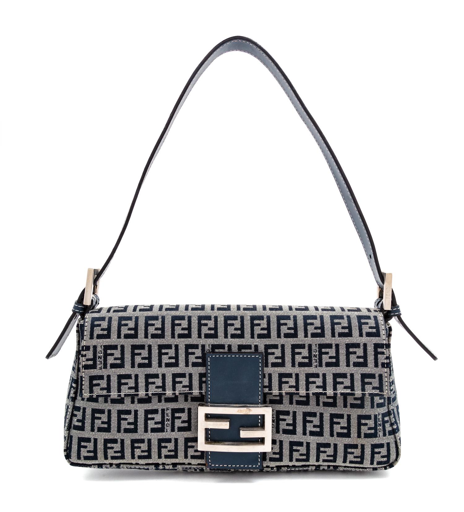 A Fendi Navy Monogram Canvas Zucca Baguette, 5" H x 10.25" W x 1.75" D; Strap drop: 6.5"- 9.5".