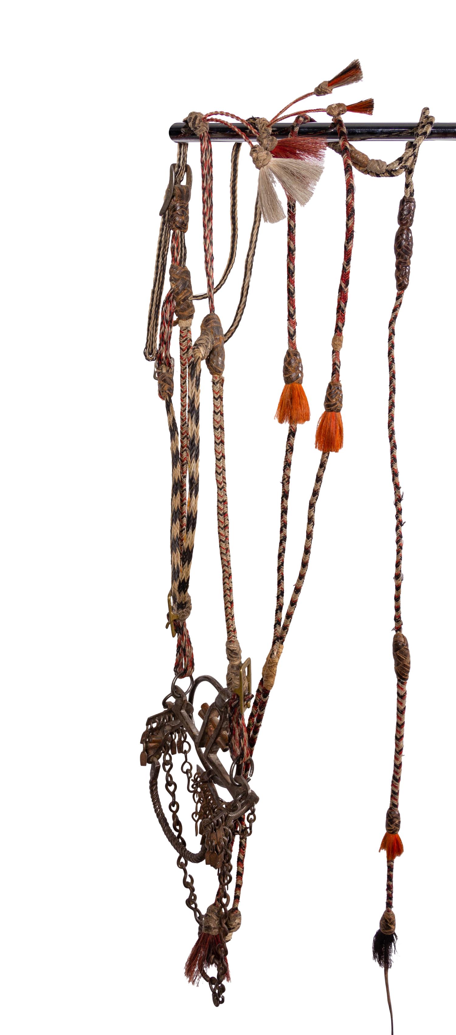 A Group of Western Horse Bridles and Quirts