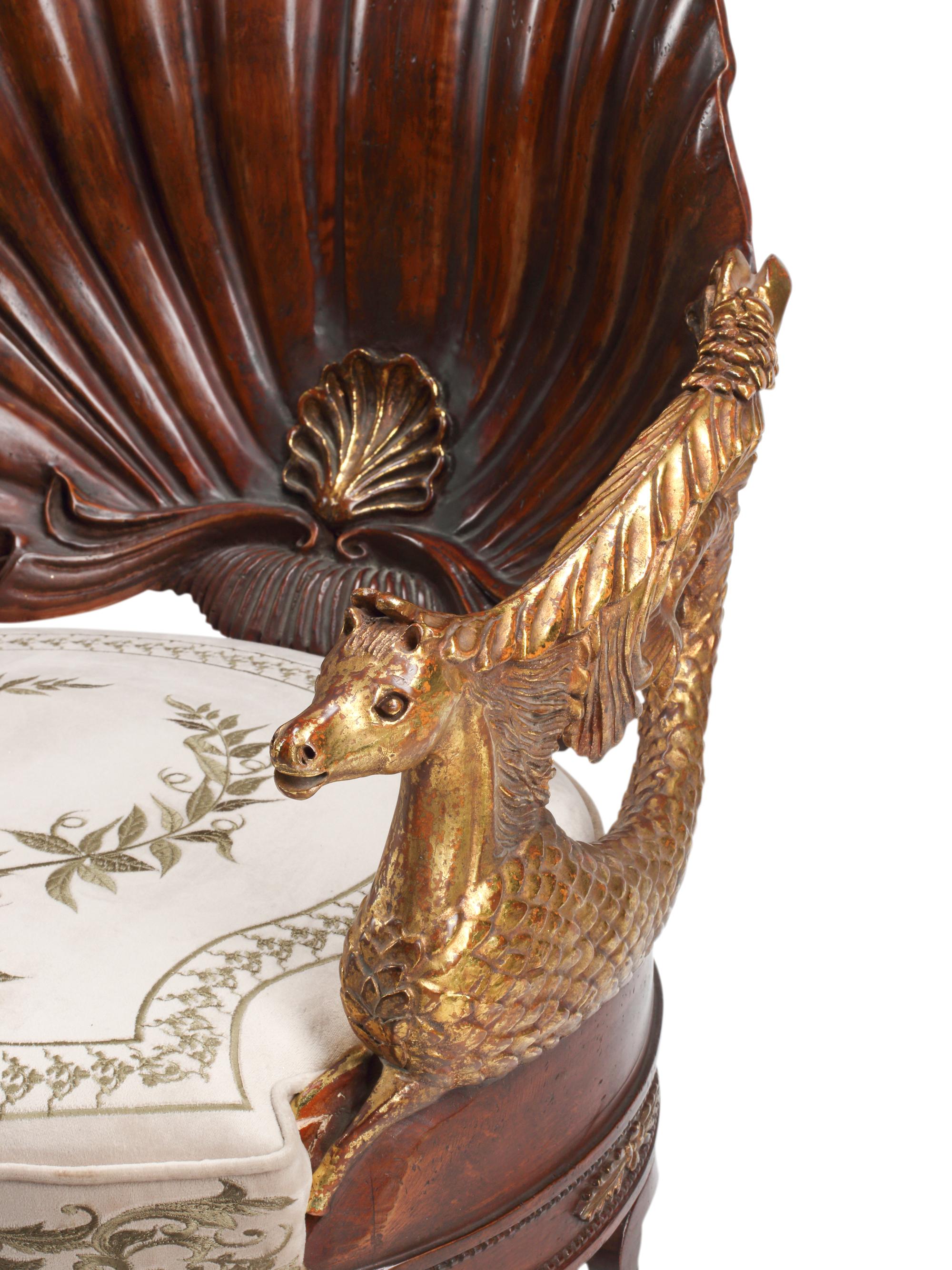 A Pair of Neoclassical Style Carved Walnut and Parcel-Gilt Shell-Form Armchairs