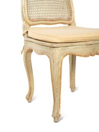 A Set of Four Louis XV Style Painted and Parcel Gilt Dining Chairs