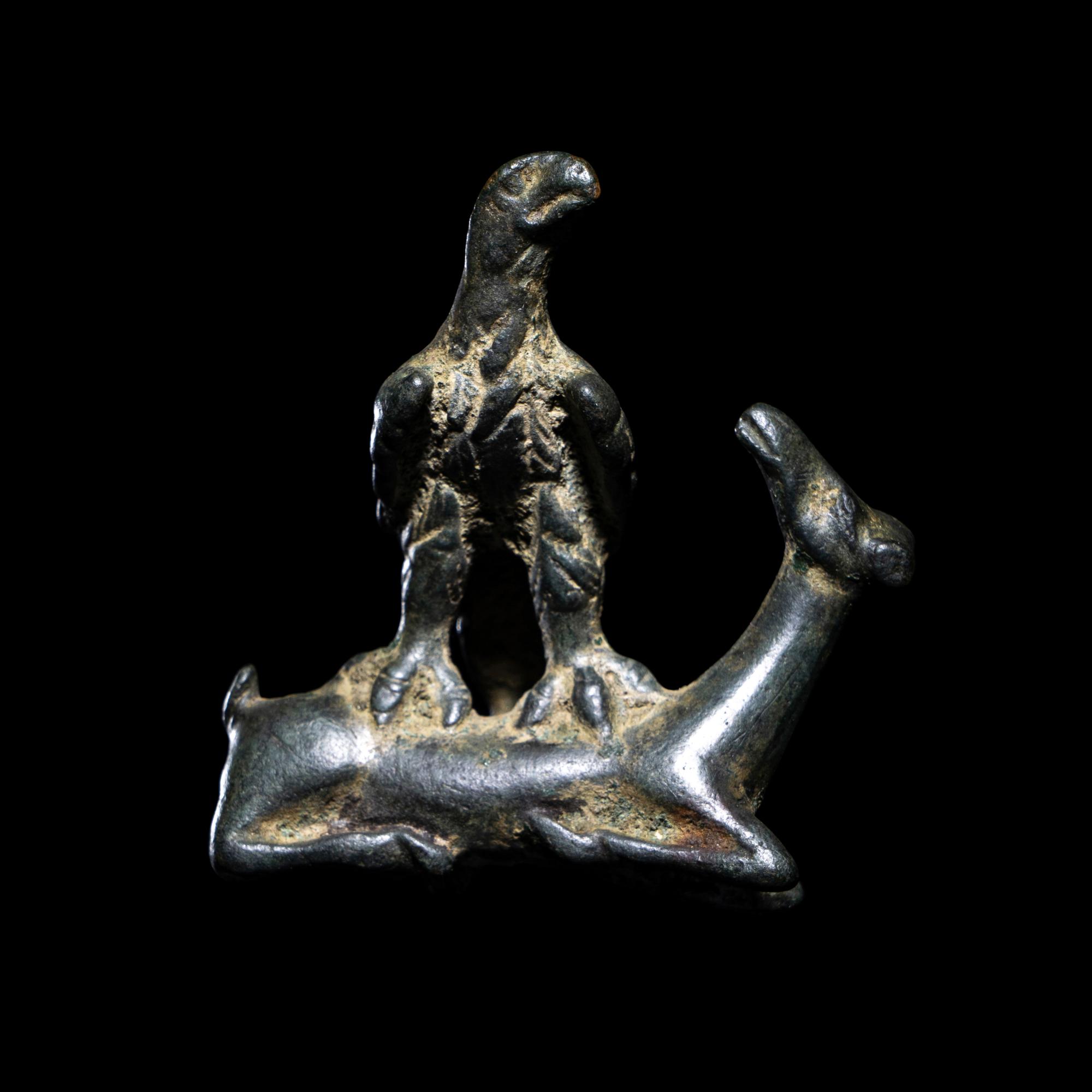 A Roman Bronze Eagle Grasping a Deer