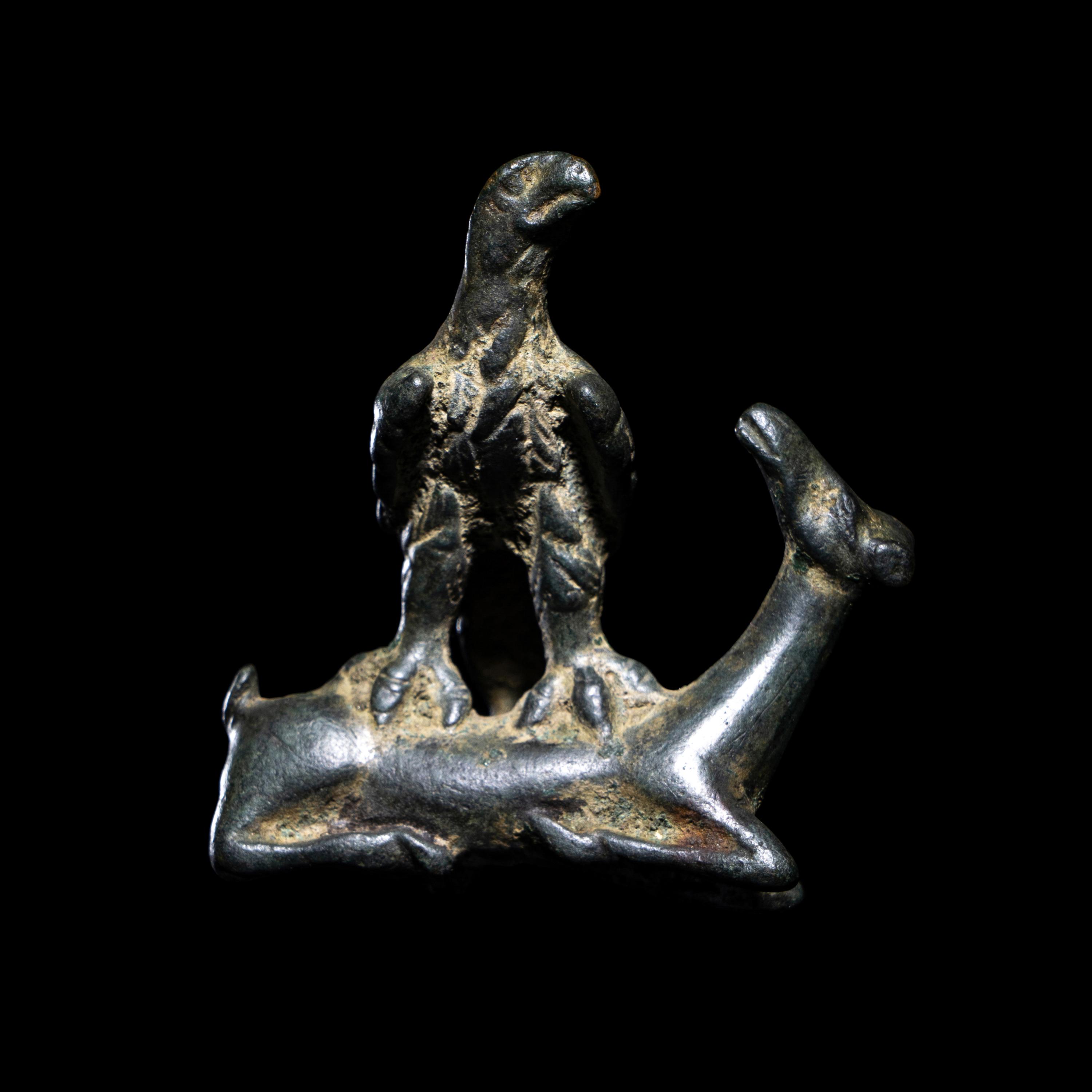 A Roman Bronze Eagle Grasping a Deer