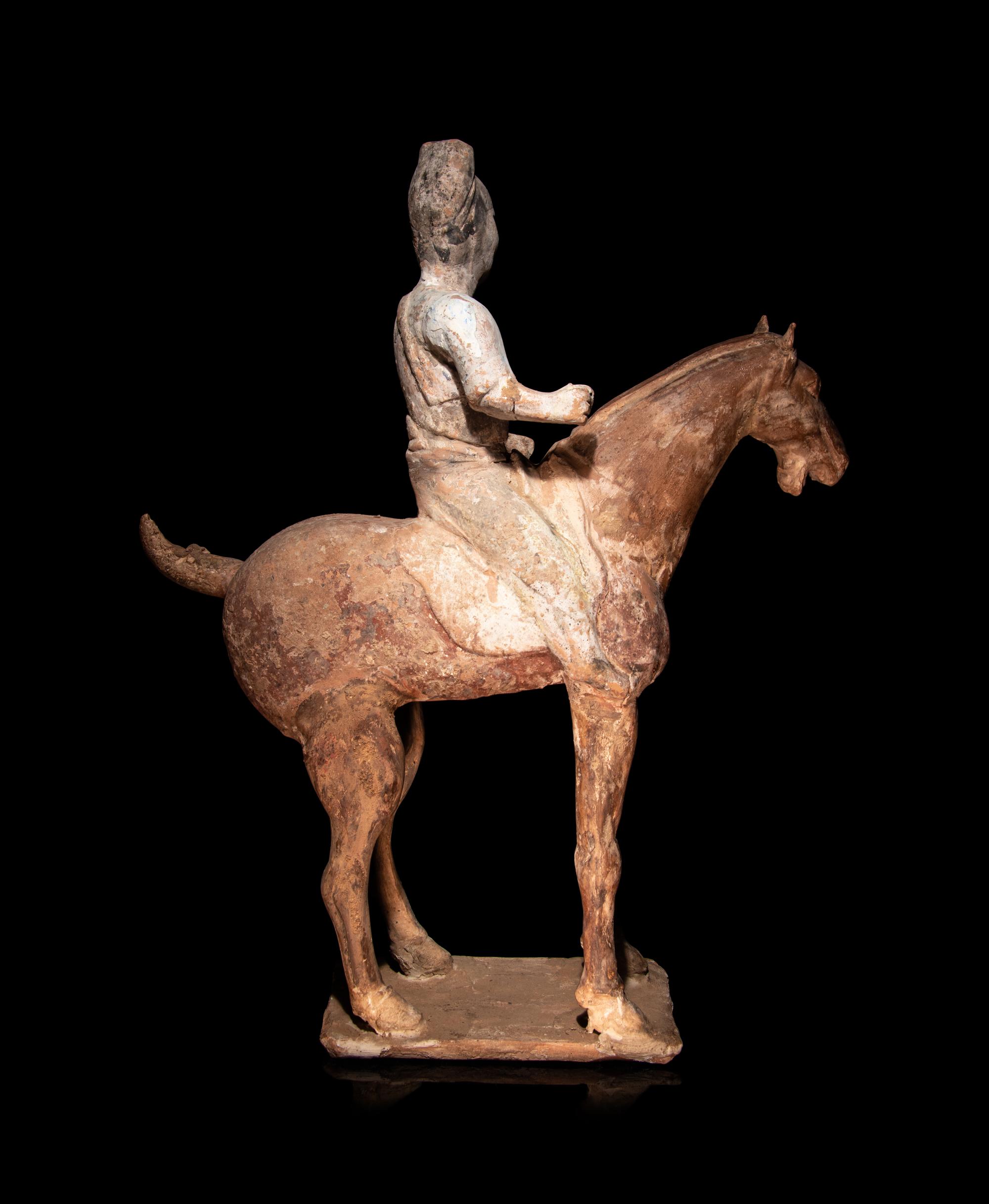 A Pair of Chinese Pottery Equestrian Figures