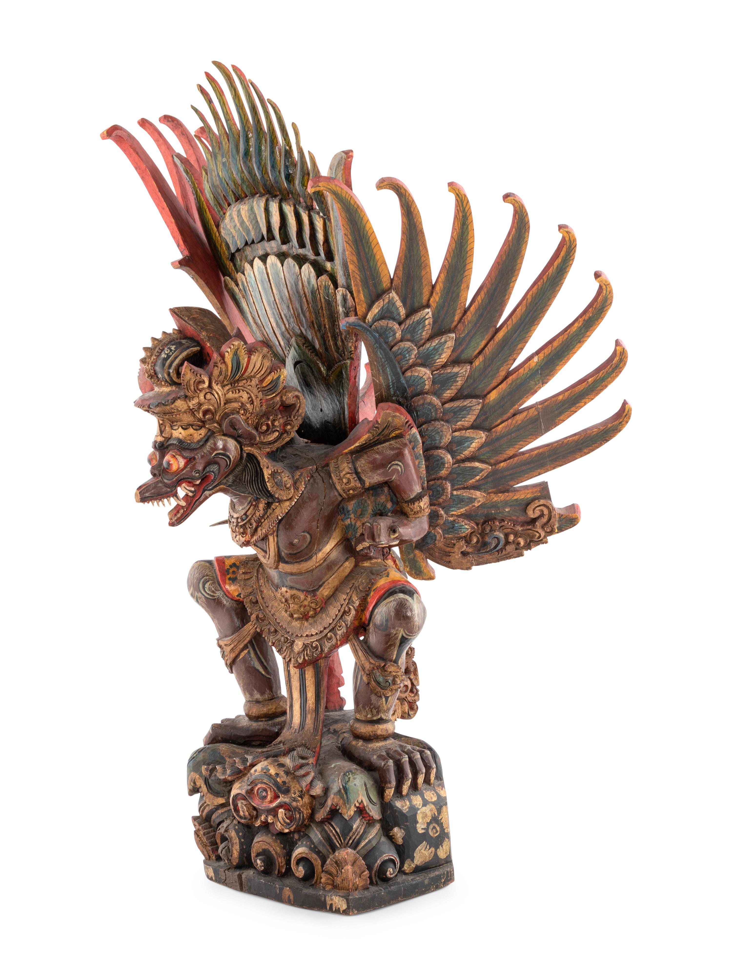 An Indian Carved and Polychrome Painted Wood Garuda Figure
